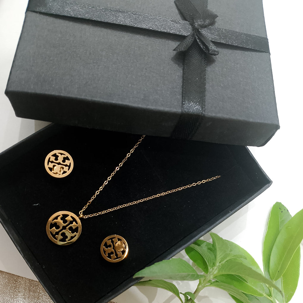 Tory Burch stainless steel pendant and ear-studs